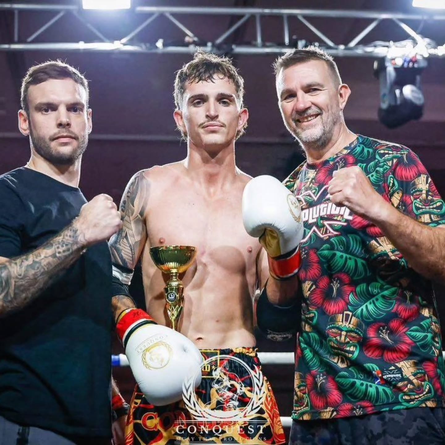 Revolution fight team celebrating together after a bout